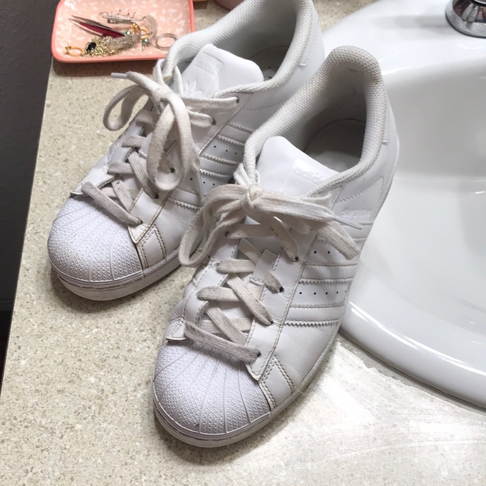 All white adidas superstars